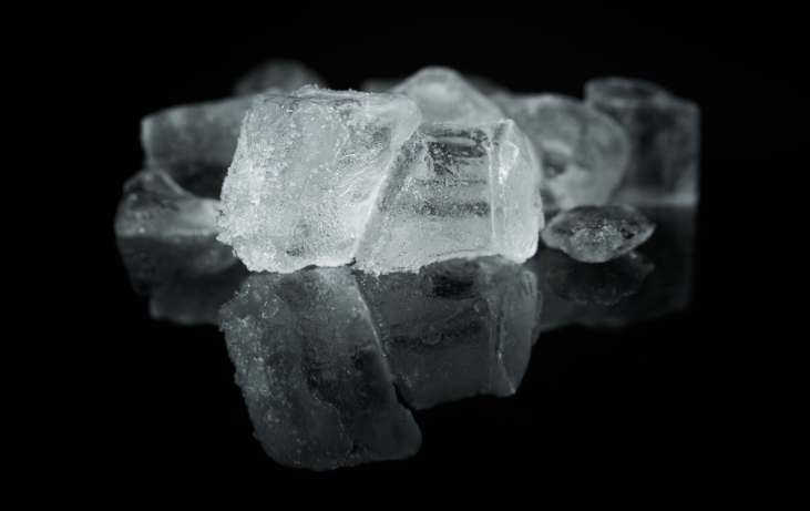 ice cubes on a black surface